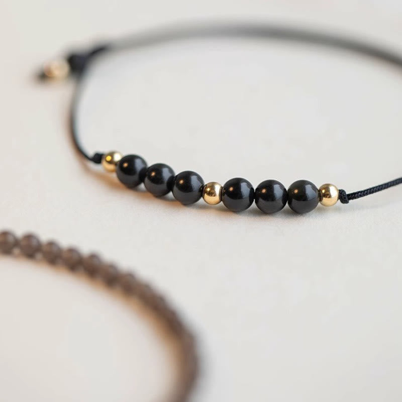 Pulsera de éxito con cuentas ultrafinas de obsidiana negra y cuarzo ahumado de Buddha Stones