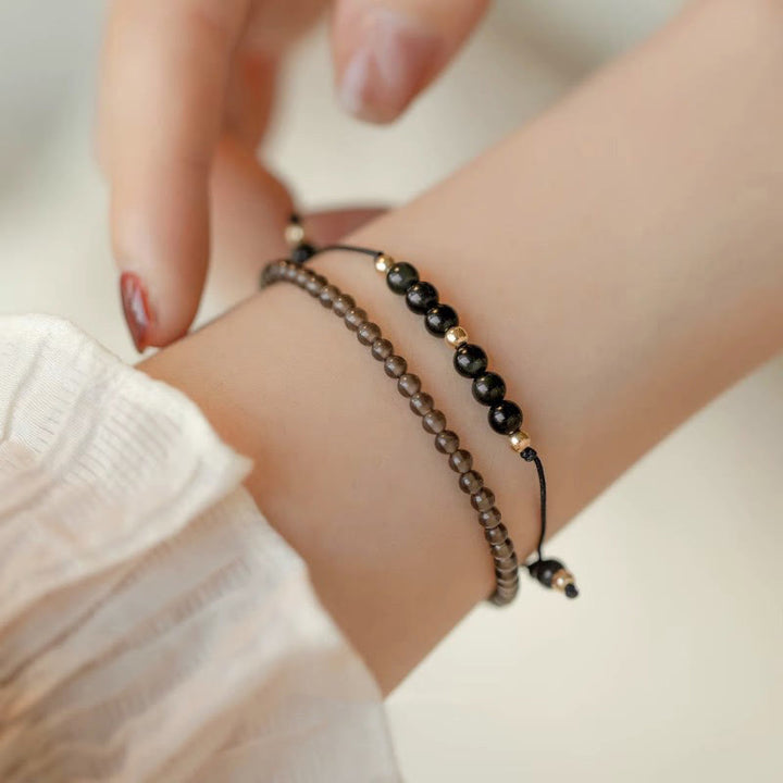 Pulsera de éxito con cuentas ultrafinas de obsidiana negra y cuarzo ahumado de Buddha Stones