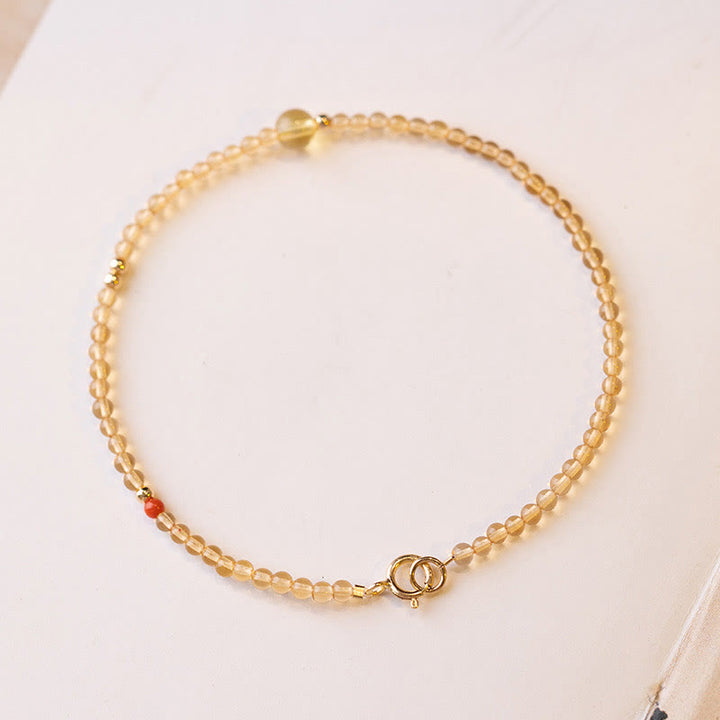 Pulsera protectora con cuentas de cobre bañadas en oro de 14 quilates y citrino ultrafinas de 2 mm de Buddha Stones