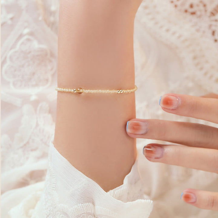 Pulsera protectora con cuentas de cobre bañadas en oro de 14 quilates y citrino ultrafinas de 2 mm de Buddha Stones