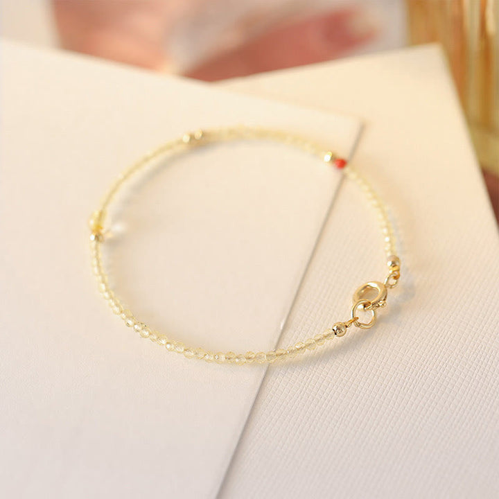 Pulsera protectora con cuentas de cobre bañadas en oro de 14 quilates y citrino ultrafinas de 2 mm de Buddha Stones
