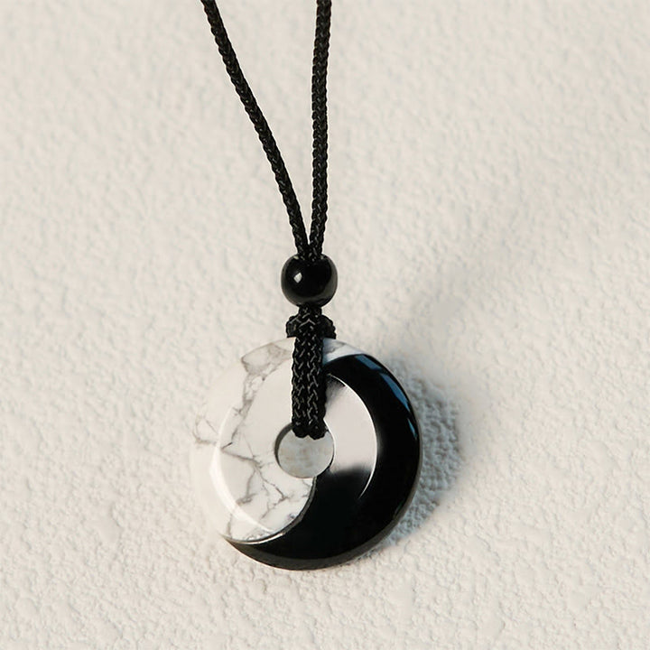 Collar con colgante de fuerza con cuerda trenzada y diseño de hebilla de paz Yin Yang con obsidiana negra natural y turquesa blanca y Buddha Stones