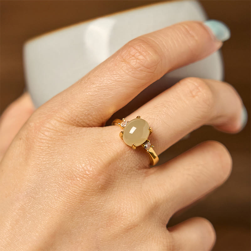 Anillo de prosperidad de cobre con forma de huevo de circonita y jade hetiano natural con Buddha Stones