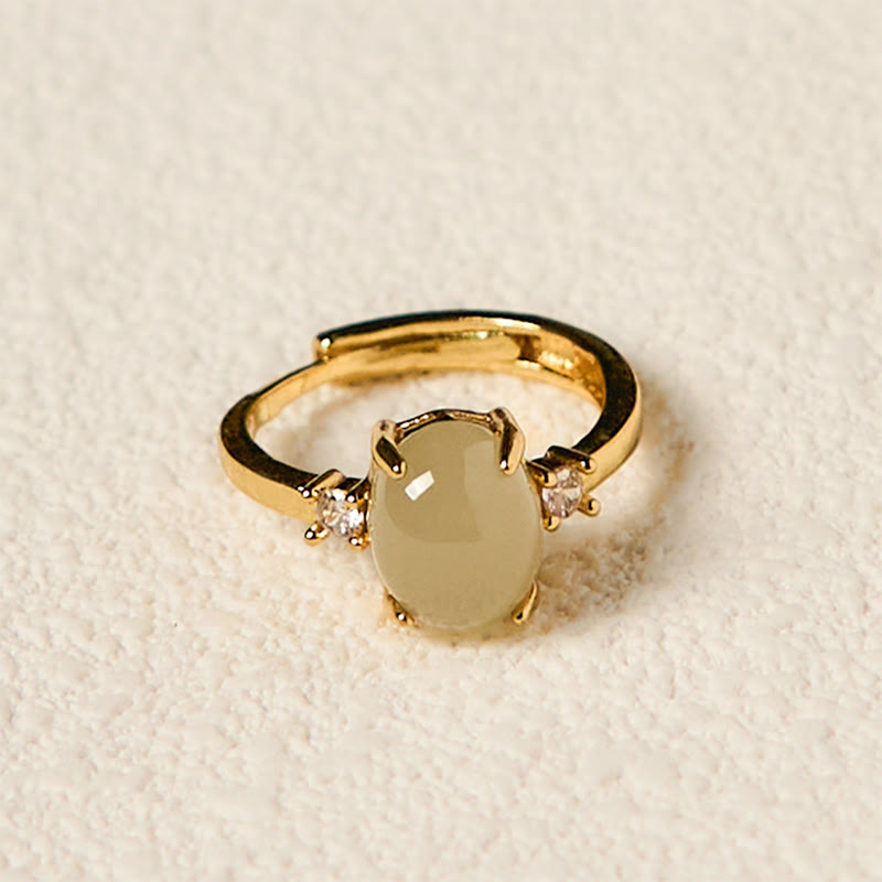 Anillo de prosperidad de cobre con forma de huevo de circonita y jade hetiano natural con Buddha Stones