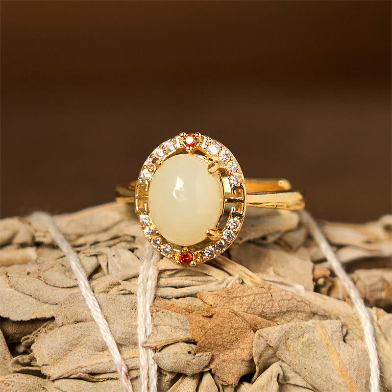 Anillo de la suerte abierto de cobre con forma de huevo de circonita y jade hetiano natural con Buddha Stones