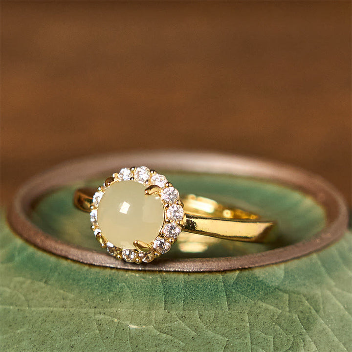 Anillo de cobre con forma de huevo de jade hetiano natural y Buddha Stones para la suerte y la prosperidad