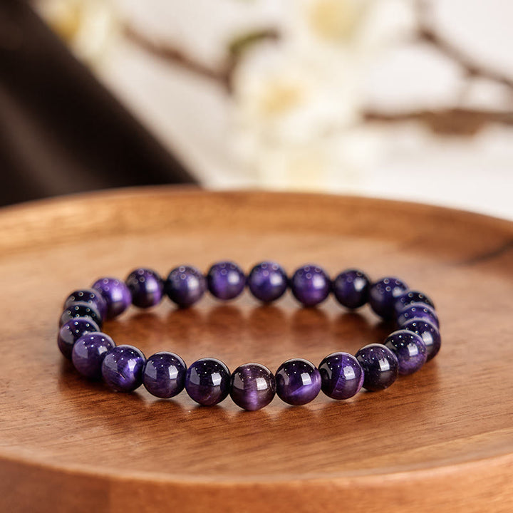Pulsera creativa con Buddha Stones y ojo de tigre morado