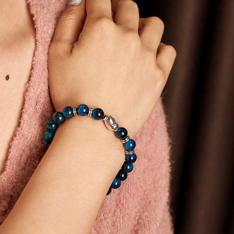 Pulsera de equilibrio con cabeza de Buda y ojo de tigre azul, verde y rojo con Buddha Stones