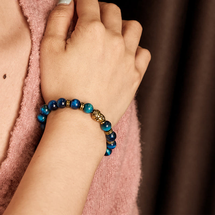 Pulsera de equilibrio con cabeza de Buda y ojo de tigre azul, verde y rojo con Buddha Stones