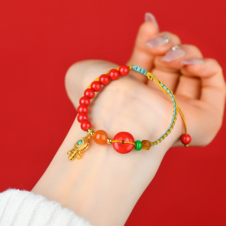 Pulsera con bendición de la paz con hilo de cinabrio y Buddha Stones