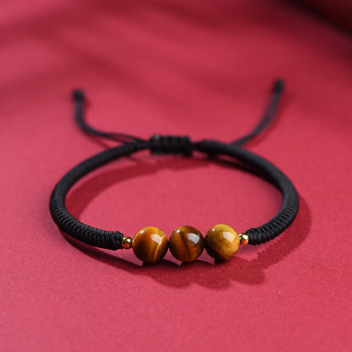 Pulsera de cuerda con cuentas de ojo de tigre y protección de la suerte hecha a mano con Buddha Stones