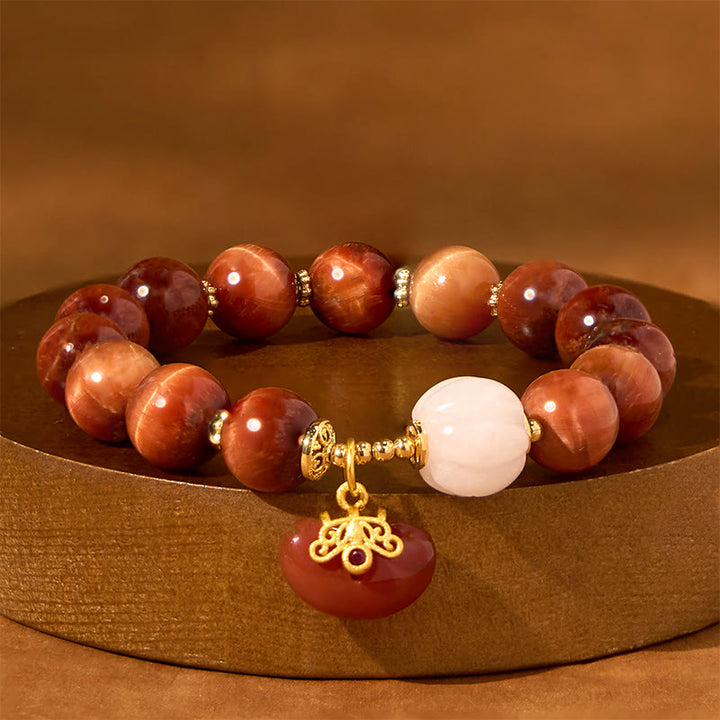 Pulsera de Buddha Stones con ojo de tigre rojo natural y calabaza calmante
