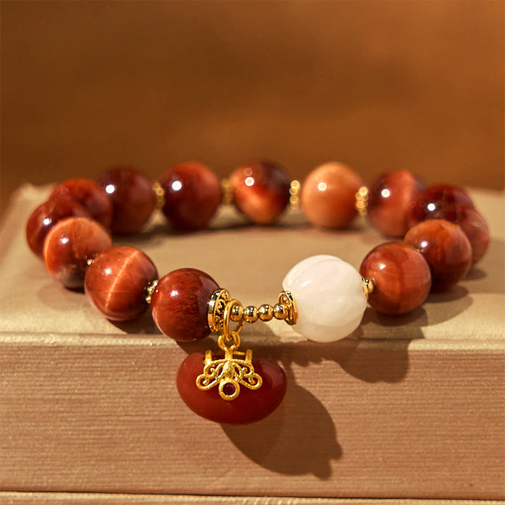Pulsera de Buddha Stones con ojo de tigre rojo natural y calabaza calmante