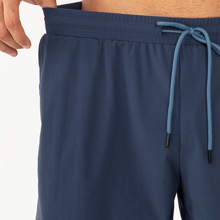 Pantalones cortos deportivos de nailon, sueltos, transpirables y de secado rápido para hombre de Buddha Stones con bolsillos