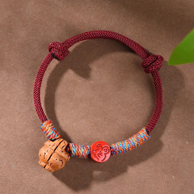 Pulsera de la suerte hecha a mano con Buddha Stones y cinabrio de hueso de melocotón con hilo rojo del zodíaco chino