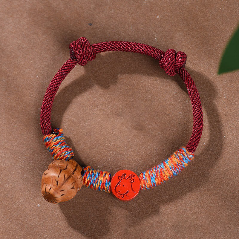 Pulsera de la suerte hecha a mano con Buddha Stones y cinabrio de hueso de melocotón con hilo rojo del zodíaco chino