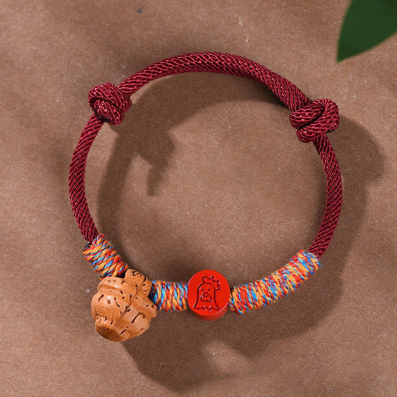Pulsera de la suerte hecha a mano con Buddha Stones y cinabrio de hueso de melocotón con hilo rojo del zodíaco chino