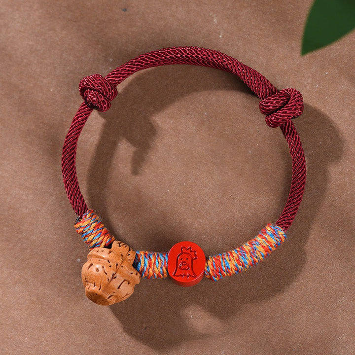 Pulsera de la suerte hecha a mano con Buddha Stones y cinabrio de hueso de melocotón con hilo rojo del zodíaco chino
