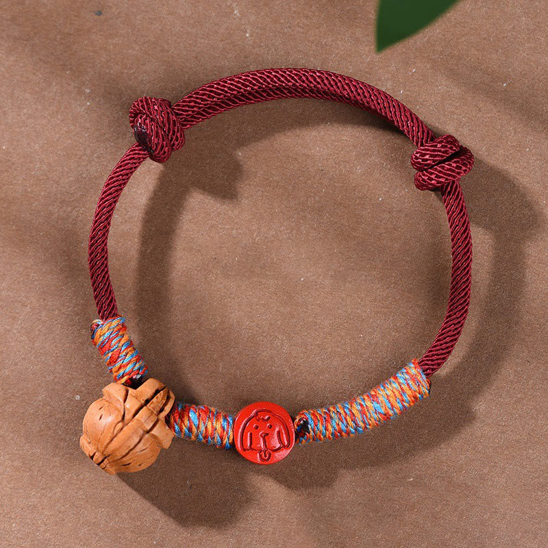 Pulsera de la suerte hecha a mano con Buddha Stones y cinabrio de hueso de melocotón con hilo rojo del zodíaco chino