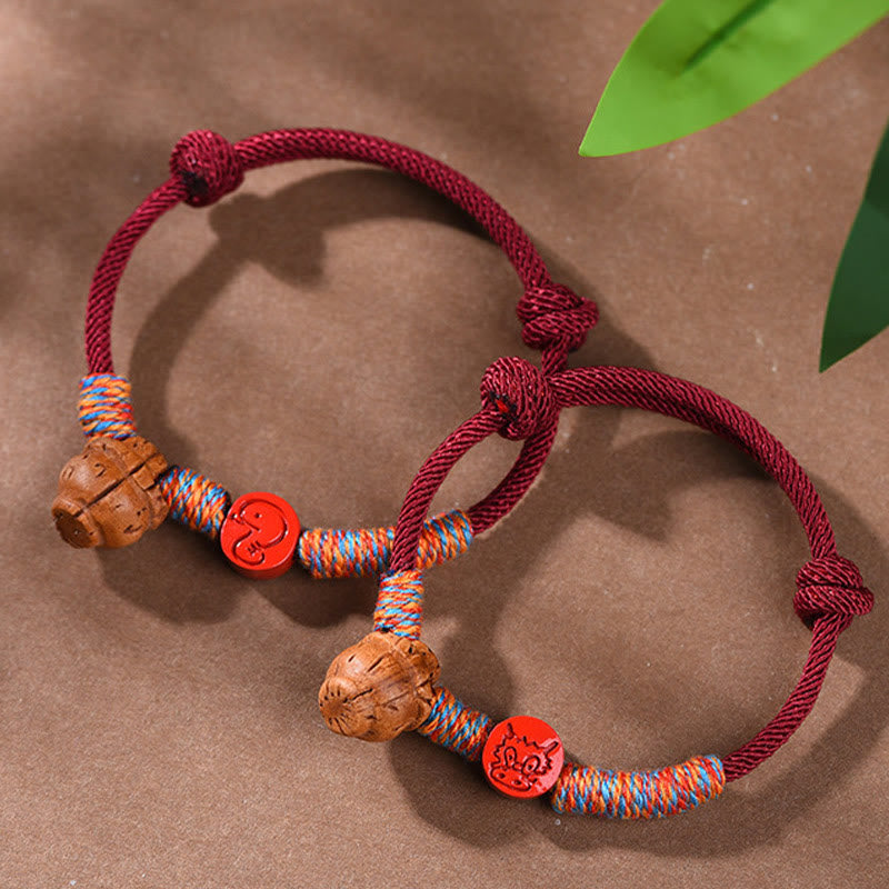 Pulsera de la suerte hecha a mano con Buddha Stones y cinabrio de hueso de melocotón con hilo rojo del zodíaco chino