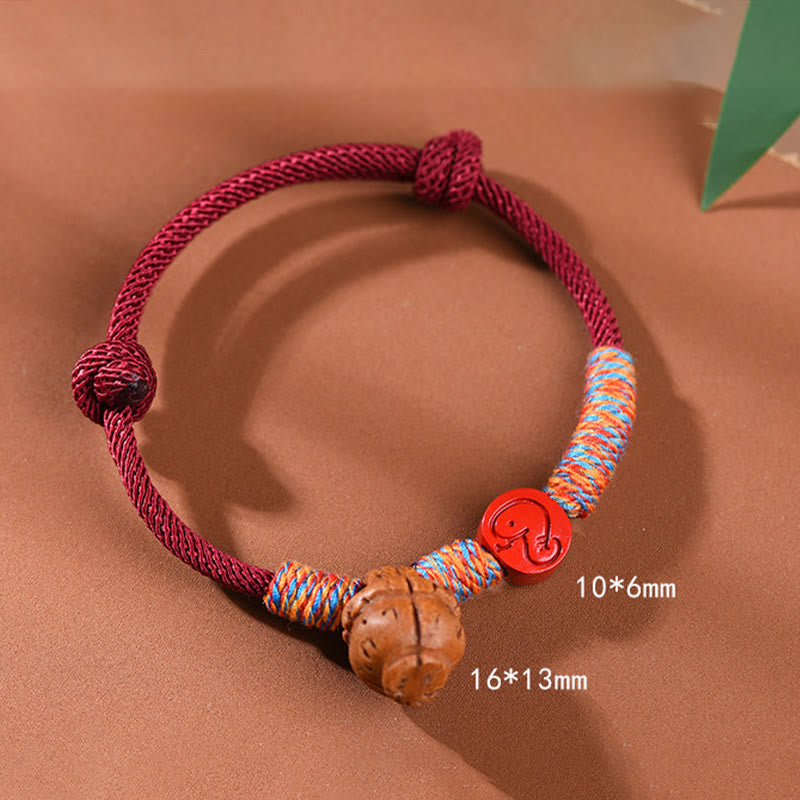 Pulsera de la suerte hecha a mano con Buddha Stones y cinabrio de hueso de melocotón con hilo rojo del zodíaco chino
