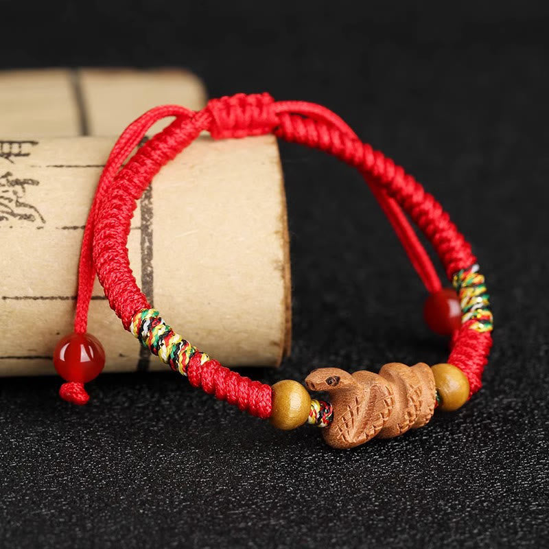 Pulsera de la suerte hecha a mano con hilo rojo del zodíaco chino y Buddha Stones en madera de durazno