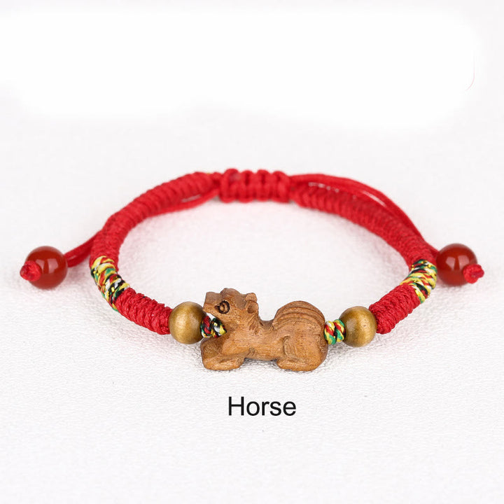 Pulsera de la suerte hecha a mano con hilo rojo del zodíaco chino y Buddha Stones en madera de durazno