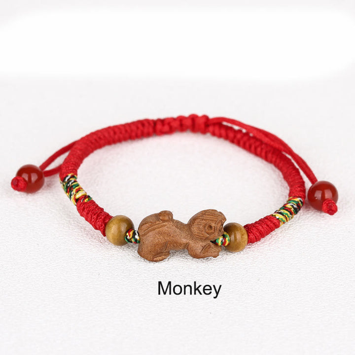 Pulsera de la suerte hecha a mano con hilo rojo del zodíaco chino y Buddha Stones en madera de durazno