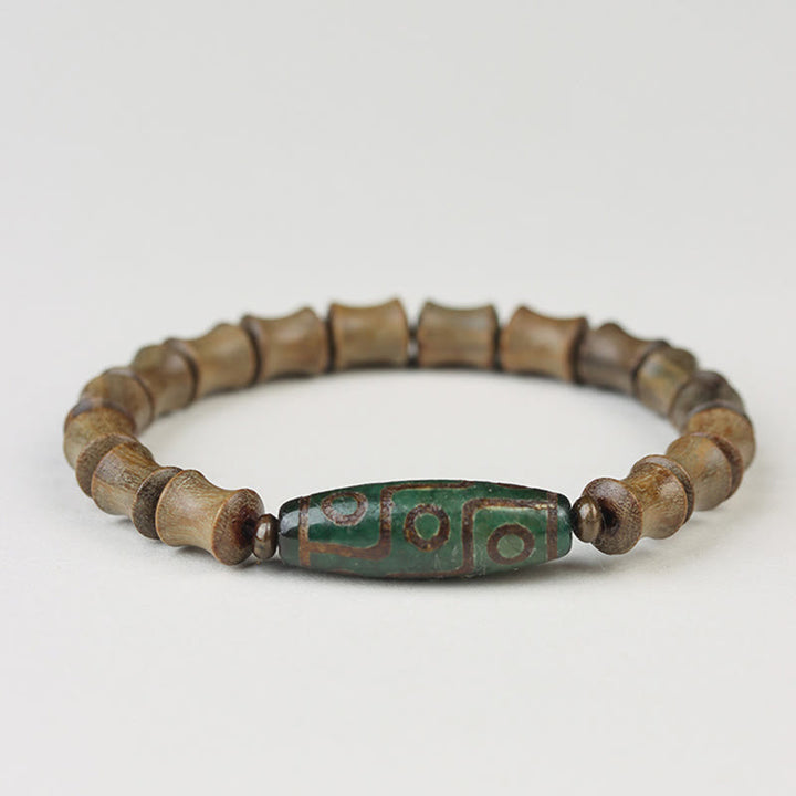 Pulsera de la paz de sándalo verde con cuentas Dzi tibetanas de nueve ojos y Buddha Stones