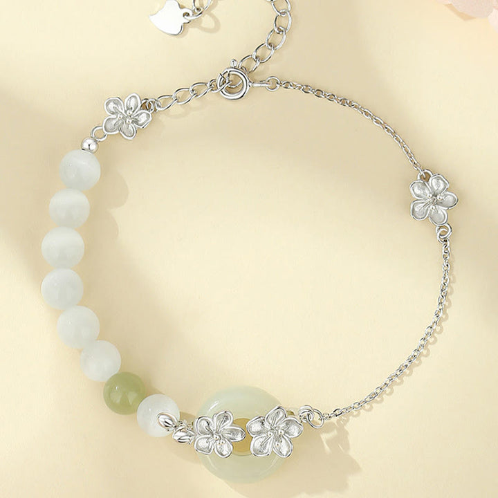 Pulsera de la suerte con hebilla de paz y flor de durazno de jade hetiano natural de plata esterlina 999 con Buddha Stones