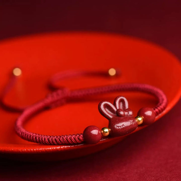 Pulsera de cuerda roja hecha a mano con Buddha Stones, cinabrio, zodíaco chino, conejo de la suerte