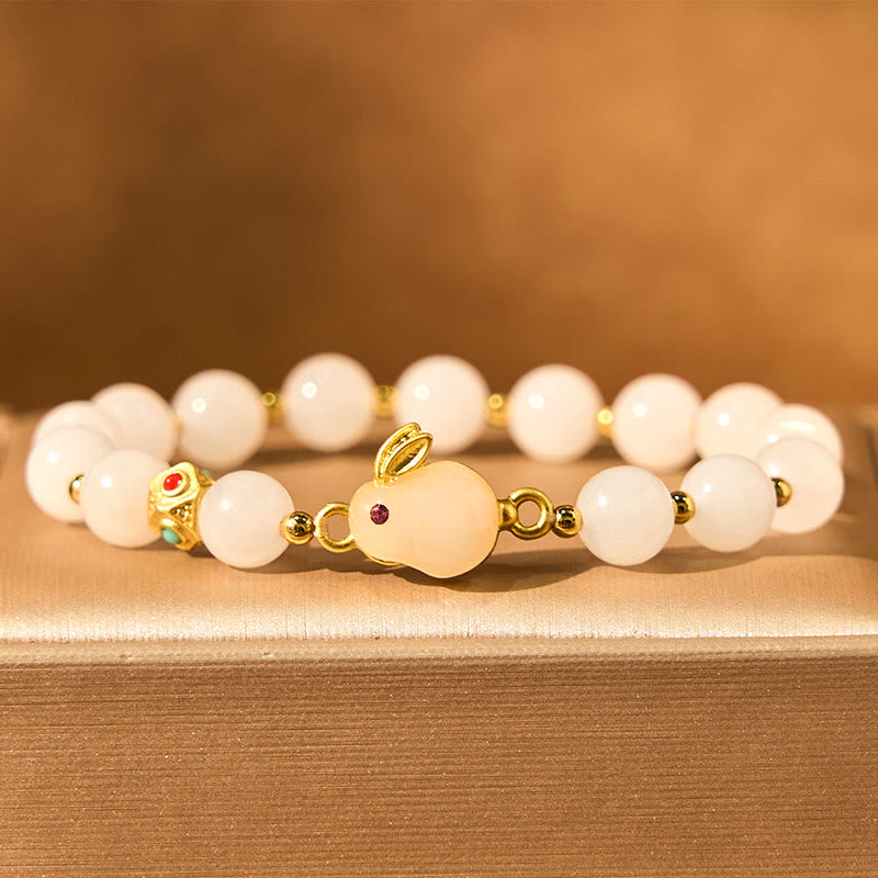 Pulsera de la suerte con bonito conejo de jade y seda dorada con Buddha Stones