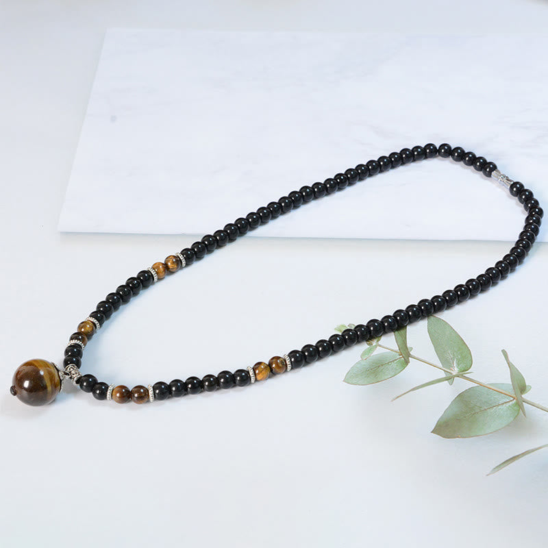 Collar con colgante de ojo de tigre y obsidiana negra con Buddha Stones para fortalecer