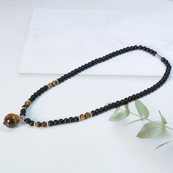 Collar con colgante de ojo de tigre y obsidiana negra con Buddha Stones para fortalecer