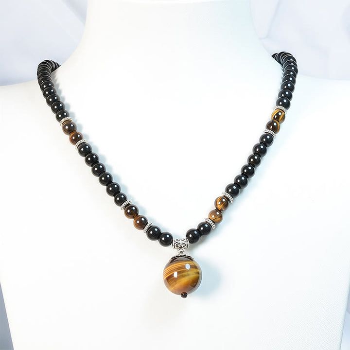 Collar con colgante de ojo de tigre y obsidiana negra con Buddha Stones para fortalecer