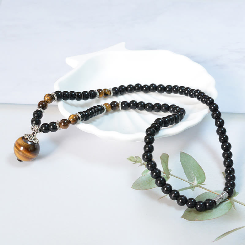 Collar con colgante de ojo de tigre y obsidiana negra con Buddha Stones para fortalecer