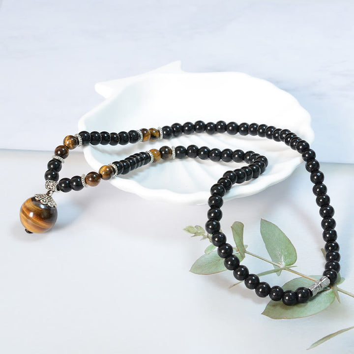 Collar con colgante de ojo de tigre y obsidiana negra con Buddha Stones para fortalecer