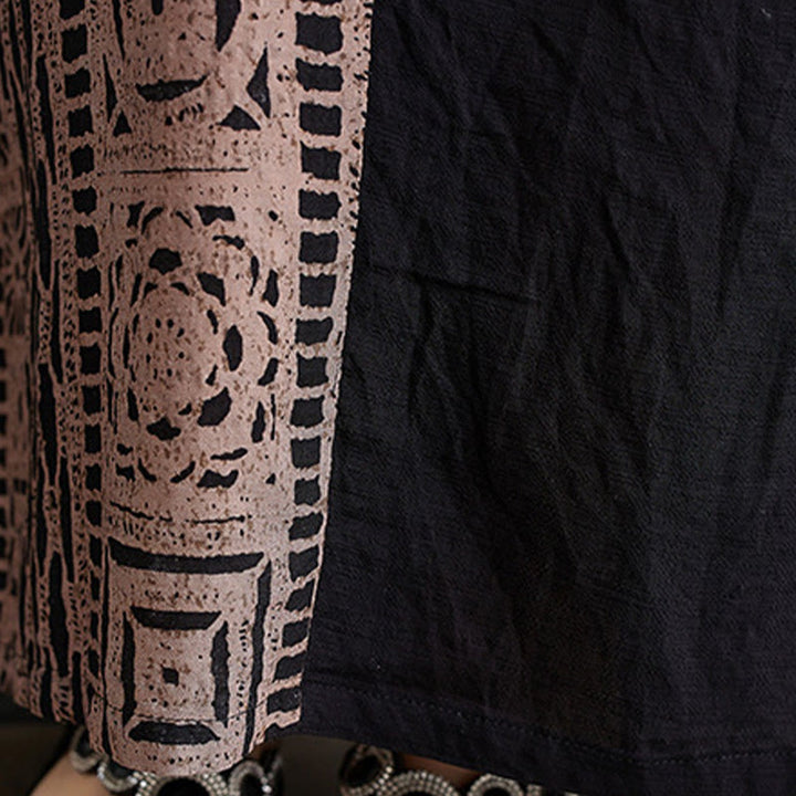Vestido midi informal holgado con estampado de Buddha Stones, de lino y algodón teñido, con escote en V y media manga y bolsillos.