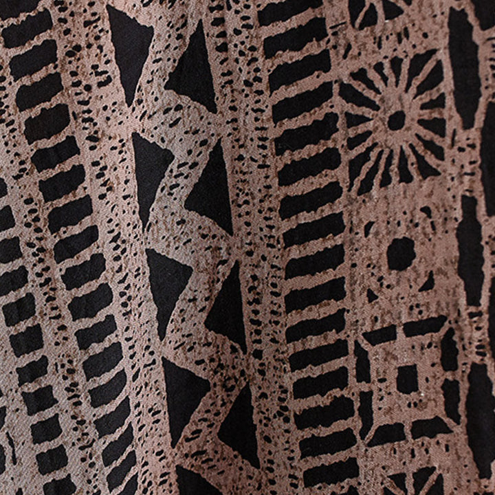 Vestido midi informal holgado con estampado de Buddha Stones, de lino y algodón teñido, con escote en V y media manga y bolsillos.