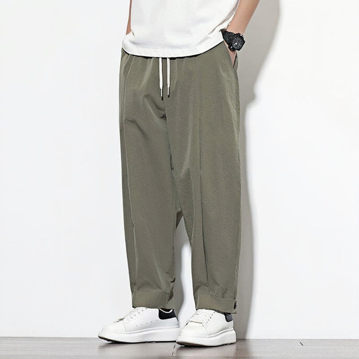 Pantalones harén casuales de color liso con cordón y bolsillos para hombre de Buddha Stones