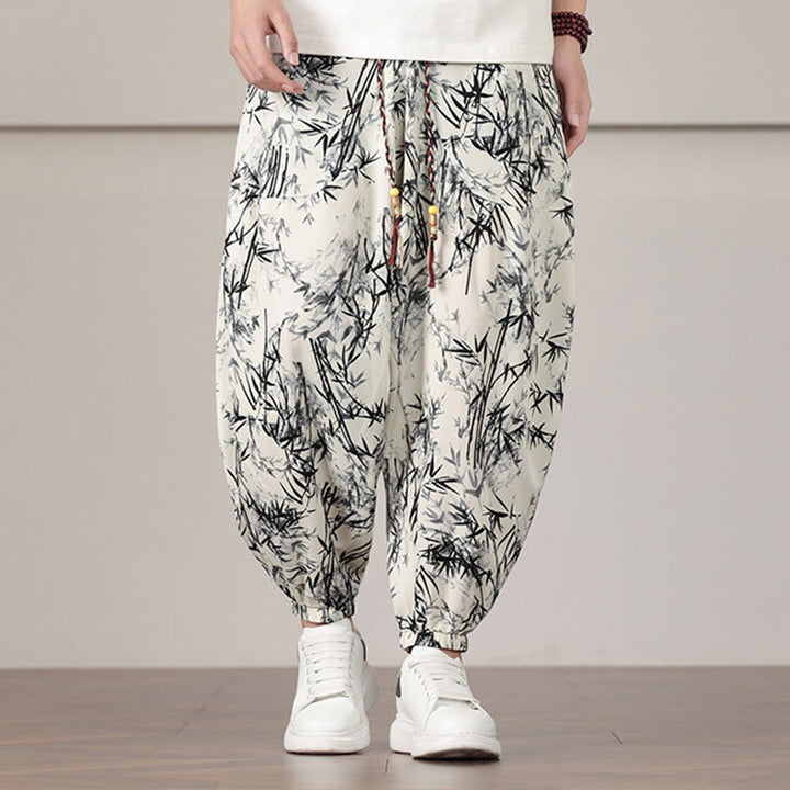 Pantalones harén con cordón y bolsillos para hombre con estampado de hojas de bambú y Buddha Stones