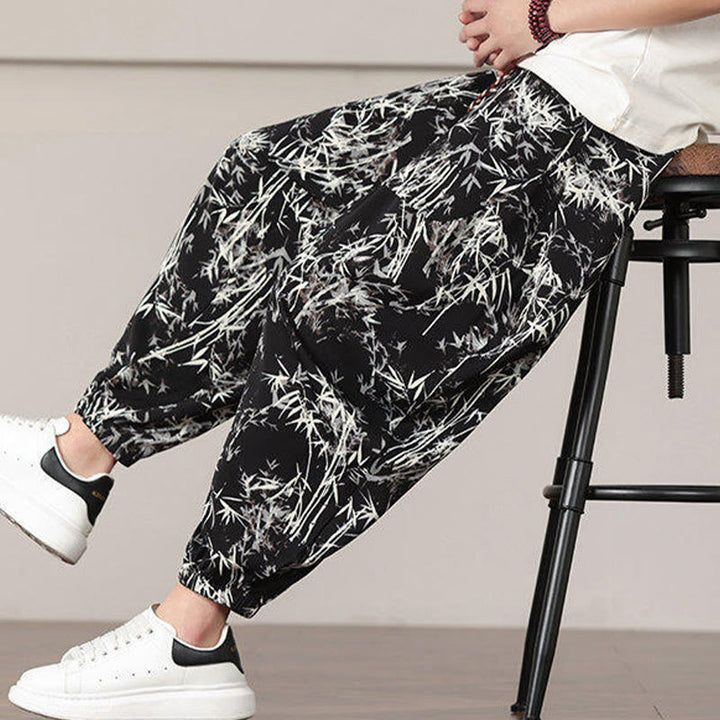 Pantalones harén con cordón y bolsillos para hombre con estampado de hojas de bambú y Buddha Stones