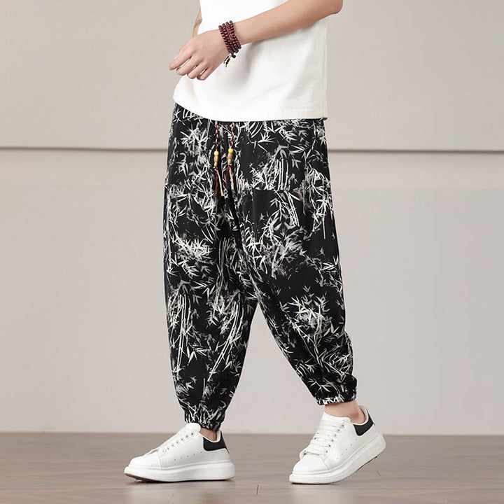 Pantalones harén con cordón y bolsillos para hombre con estampado de hojas de bambú y Buddha Stones