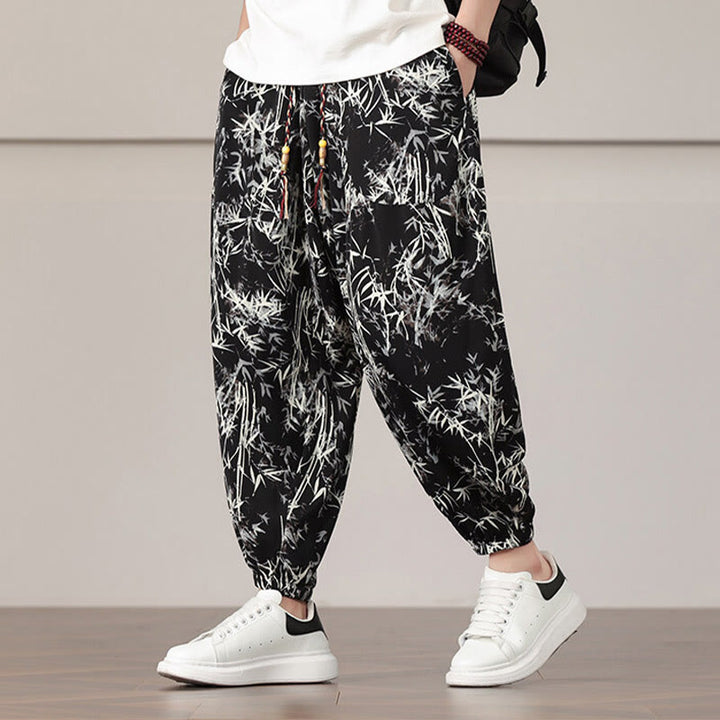 Pantalones harén con cordón y bolsillos para hombre con estampado de hojas de bambú y Buddha Stones