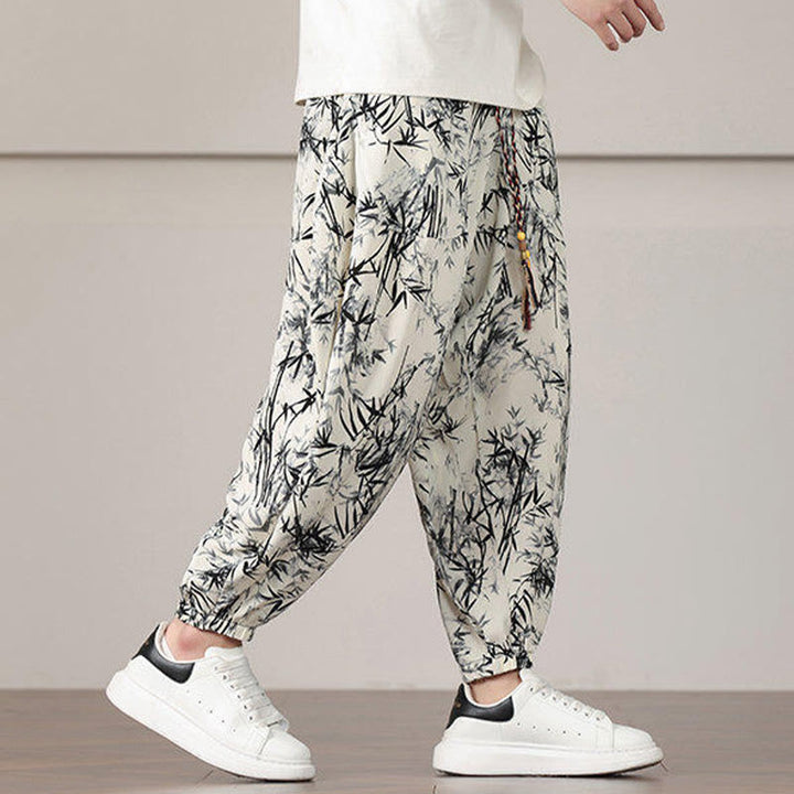Pantalones harén con cordón y bolsillos para hombre con estampado de hojas de bambú y Buddha Stones