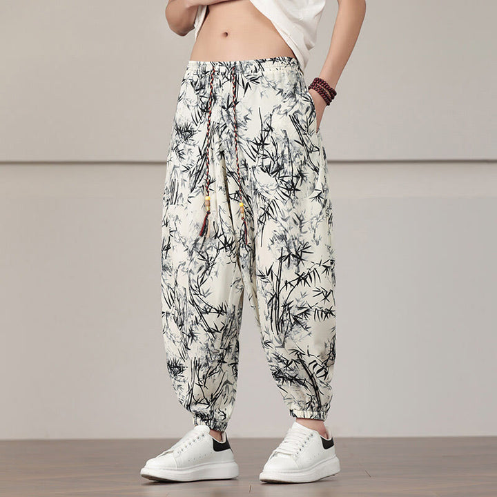 Pantalones harén con cordón y bolsillos para hombre con estampado de hojas de bambú y Buddha Stones