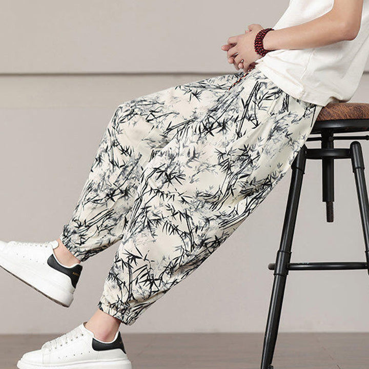 Pantalones harén con cordón y bolsillos para hombre con estampado de hojas de bambú y Buddha Stones