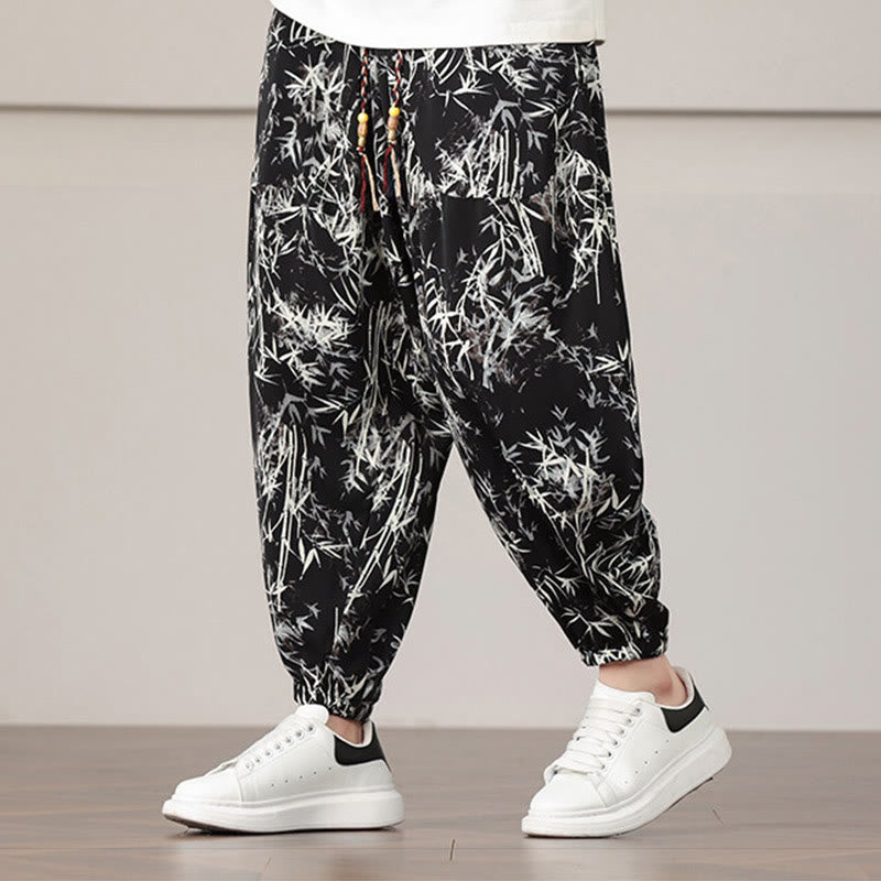 Pantalones harén con cordón y bolsillos para hombre con estampado de hojas de bambú y Buddha Stones