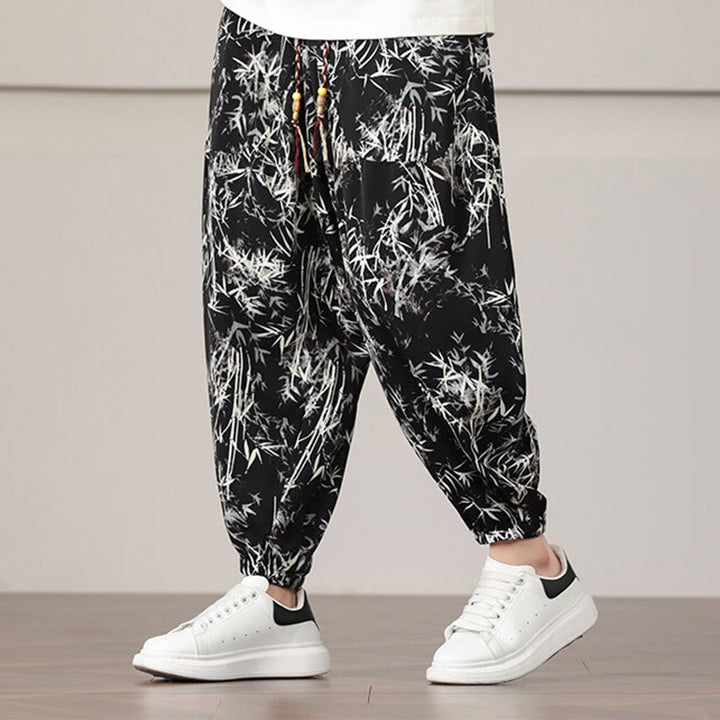 Pantalones harén con cordón y bolsillos para hombre con estampado de hojas de bambú y Buddha Stones