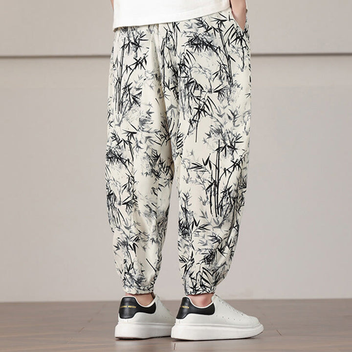 Pantalones harén con cordón y bolsillos para hombre con estampado de hojas de bambú y Buddha Stones